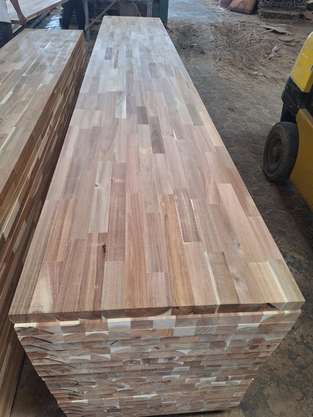 Stack of unfinished finger-jointed butcher block panels